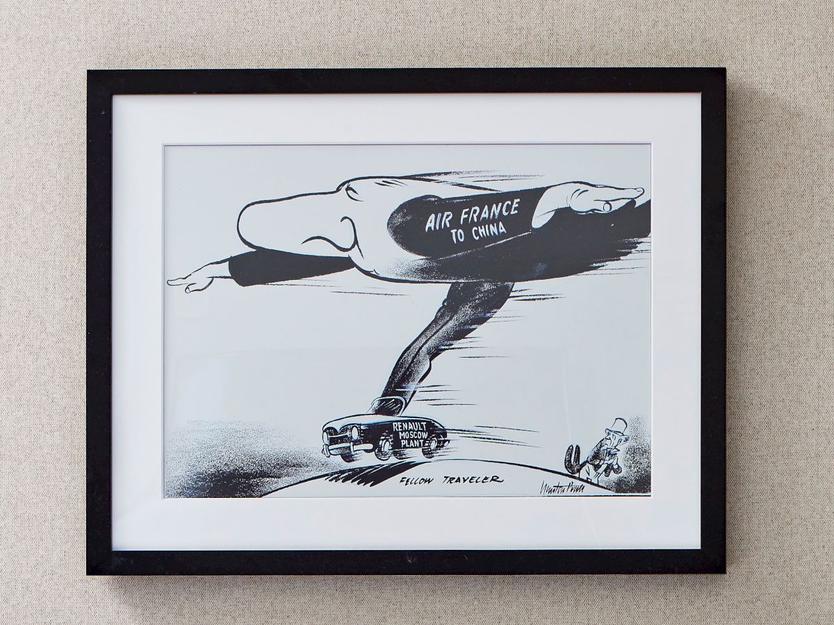 Framed illustration of a jet labeled &ldquo;AIR FRANCE TO CHINA,&rdquo; with &ldquo;Renault Moscow Plant&rdquo; and tiny figures below.